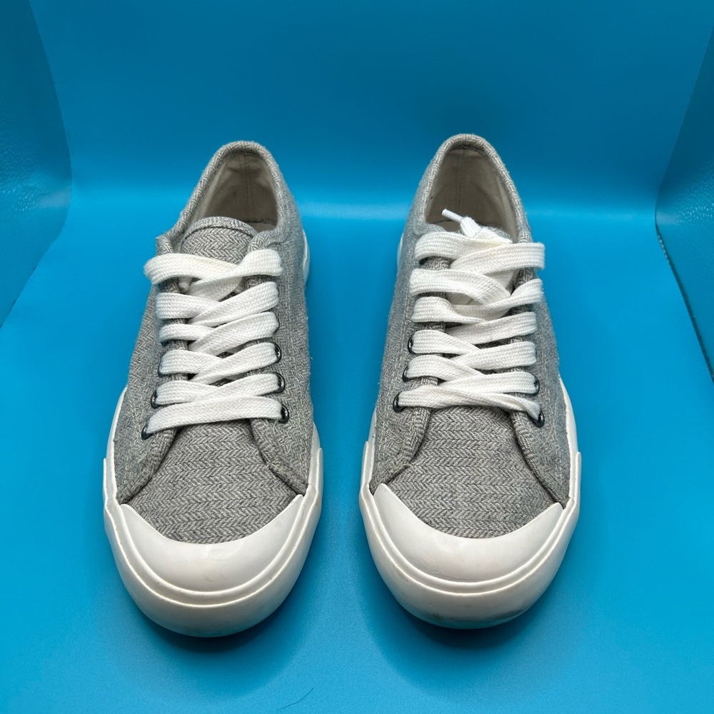 Rocket Dog shoes in gray with a label on side of shoe.